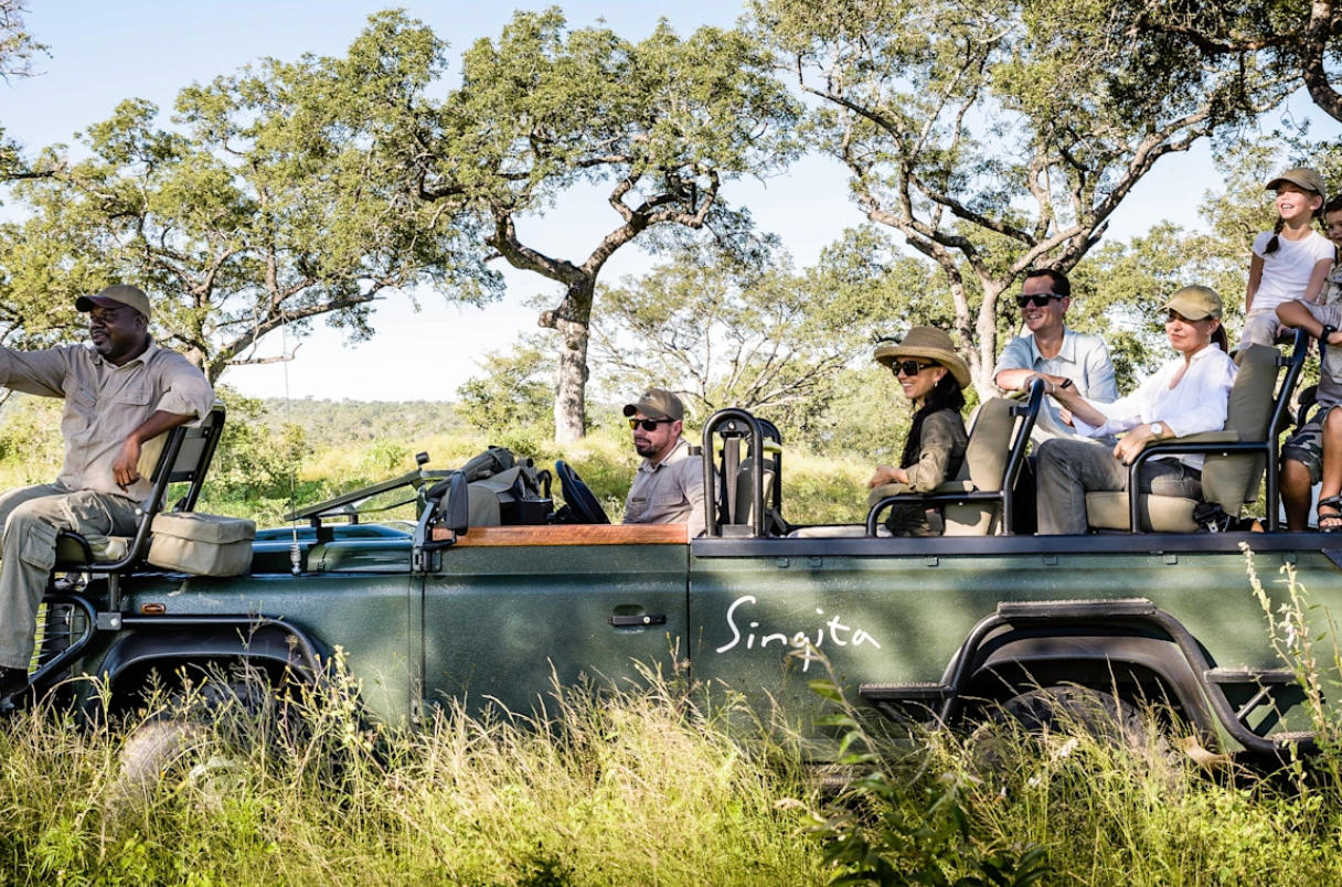 Safari lodge deck overlooking open savanna at sunset