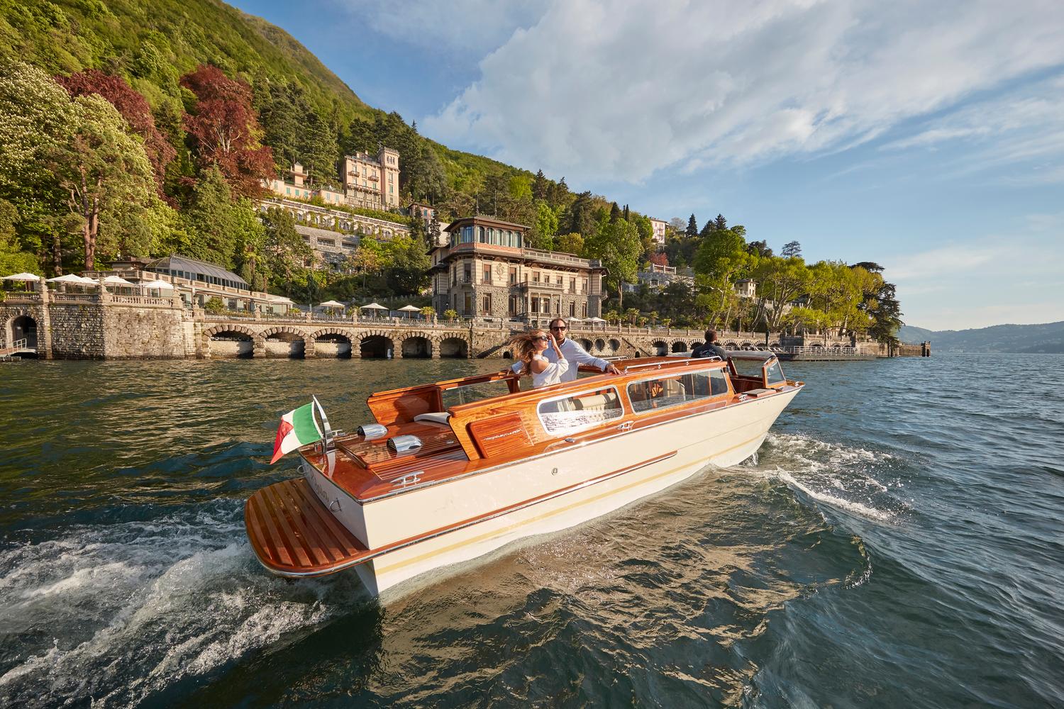 Lake Como early morning, boat and villa garden reflection